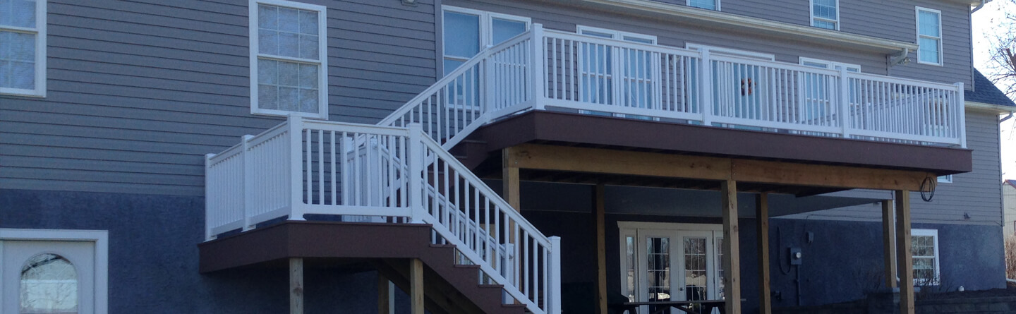 two story custom deck with white vinyl railing