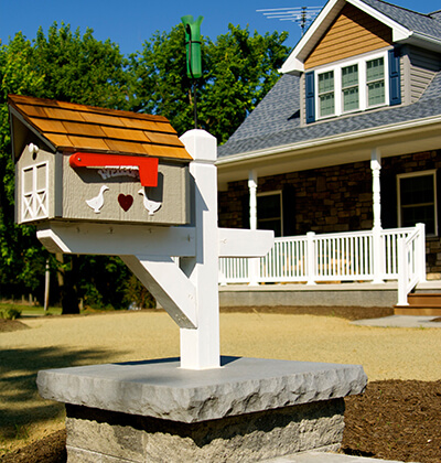 close up image of newly renovated home and new custom mail box