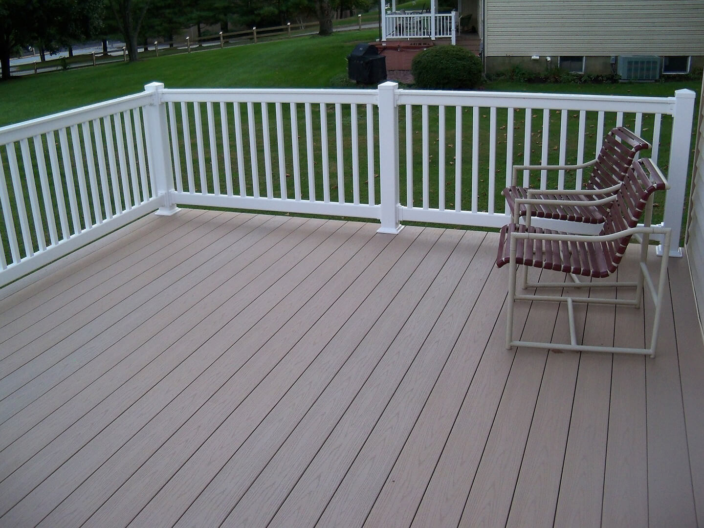 azek deck with white vinyl railing all around deck