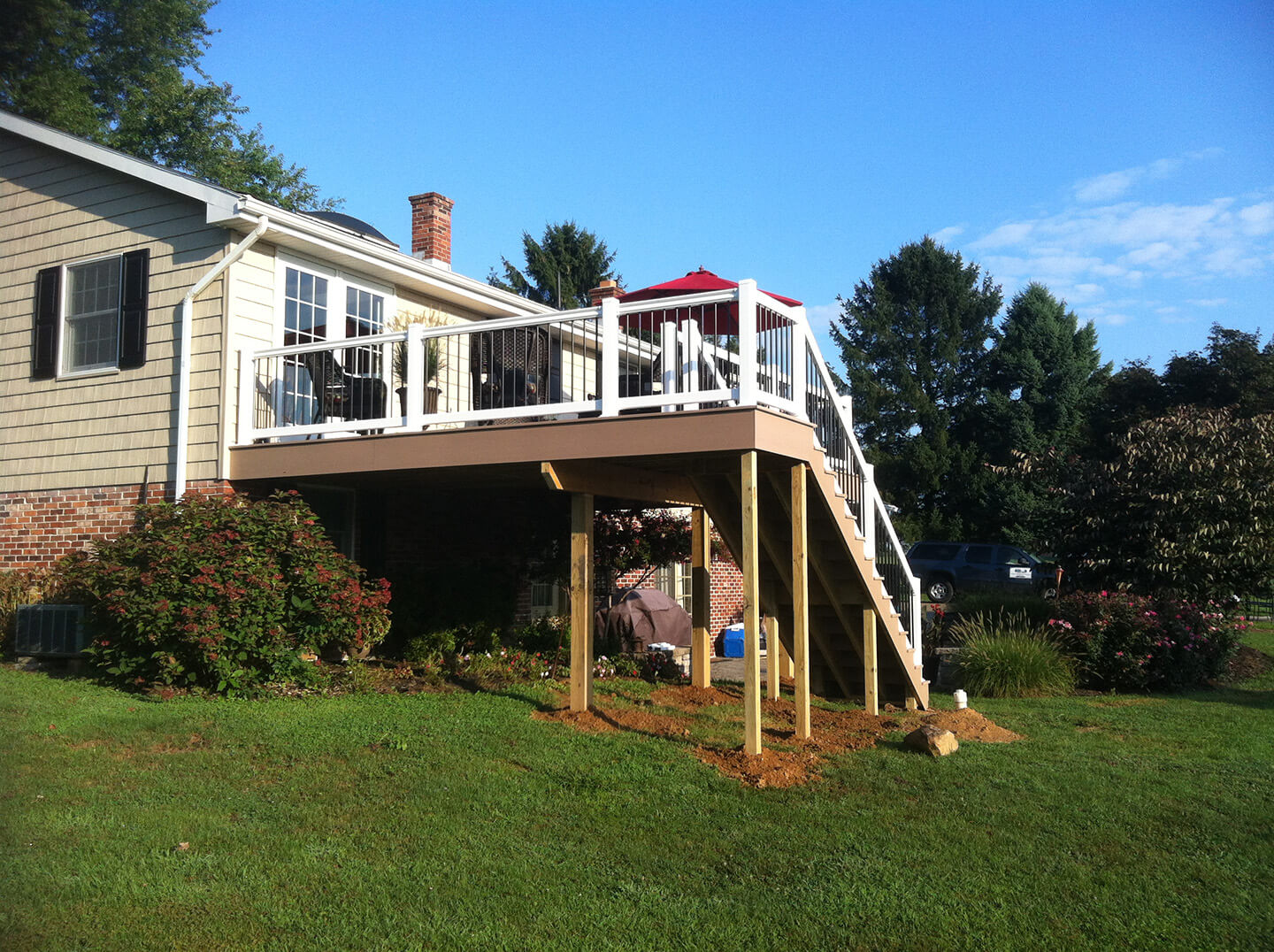 side view of brownstone azek attached deck with staircase