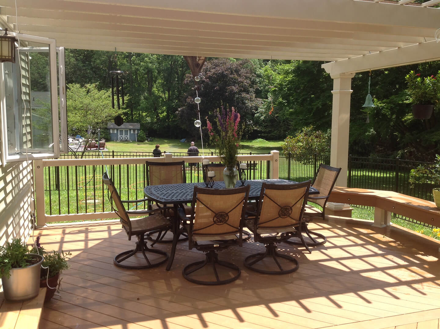 custom azek deck with pergola and furnished patio table