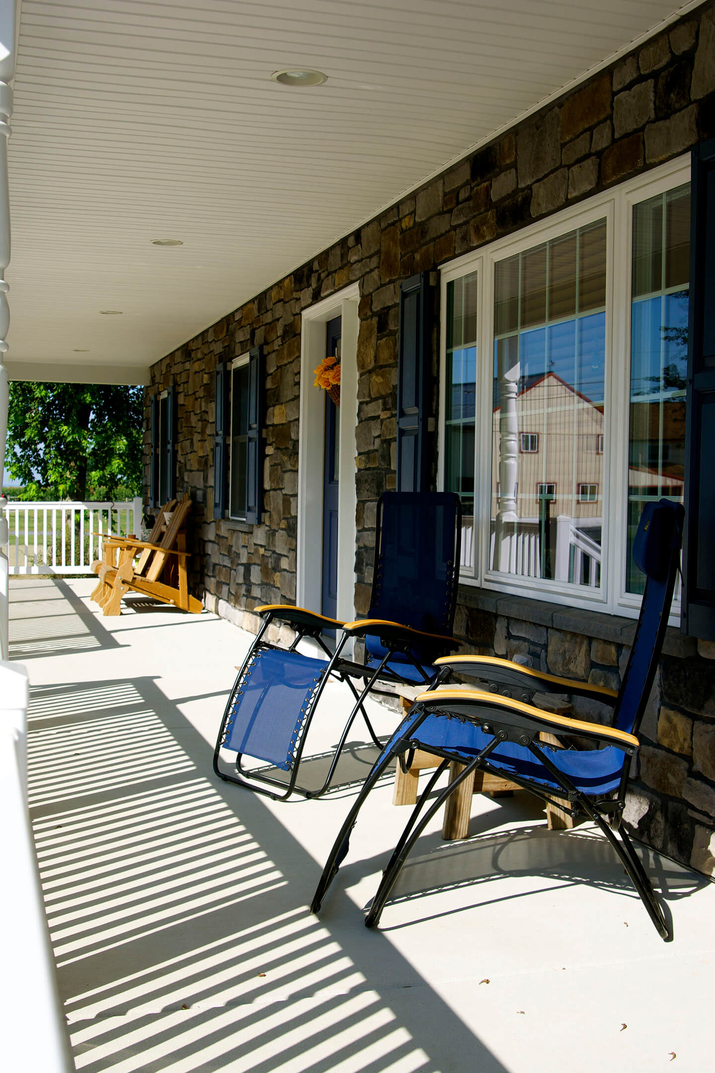 furnished front porch addition on stone house