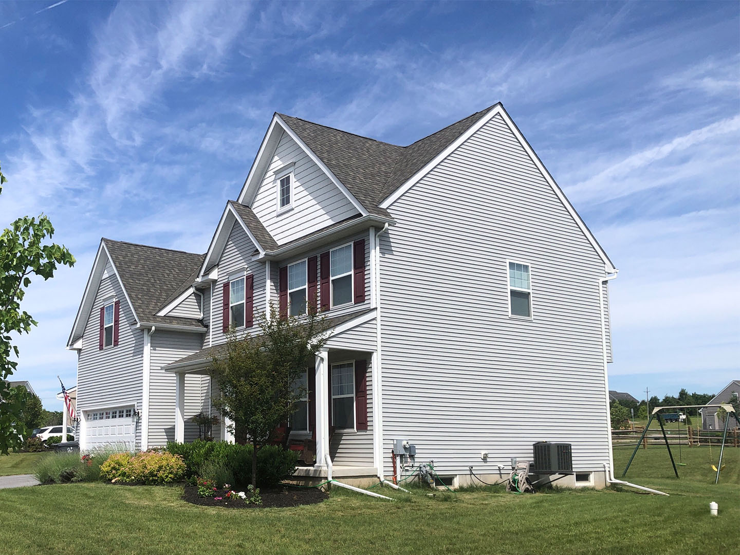 side shot of a home before a cape cod style addition