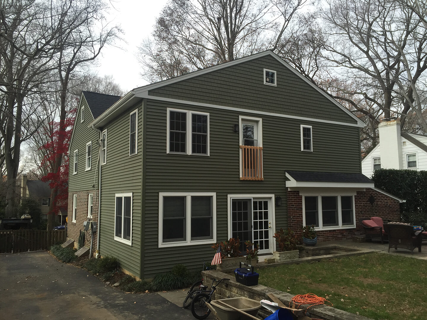 after image of completed two story house with new master suite addition