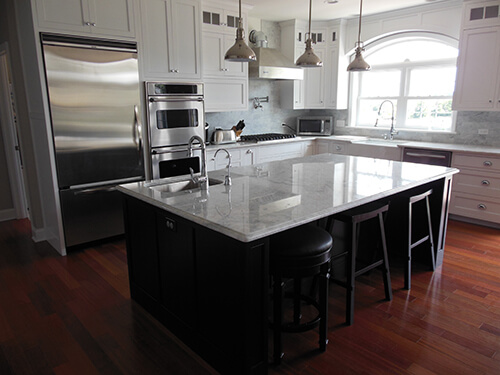kitchen remodel with hardwood floors and marble countertops