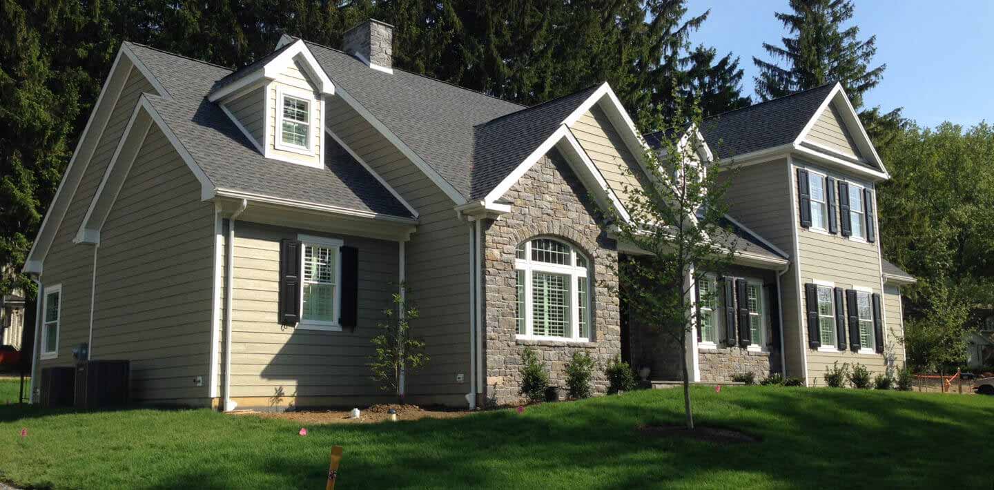 contemporary home with large cape cod style attached addition