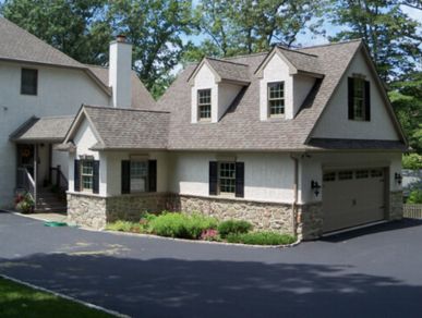 large cape cod custom home garage